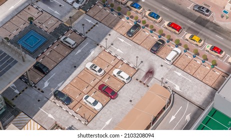 Aerial View Of Car Crowded Parking Lot Near Apartment Buildings Timelapse During All Day. Row Of Taxi Cabs Waiting Near A Road. Shadows Moving Fast