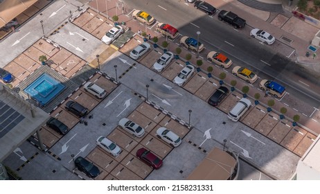 Aerial View Of Car Crowded Parking Lot Near Apartment Buildings Timelapse During All Day. Row Of Taxi Cabs Waiting Near A Road. Shadows Moving Fast