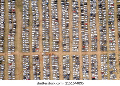 Aerial View Of A Car Distribution Center, Cars Parked In Rows On A Lot Ready For Sale. Cars Lined Up At The Port For Import And Export.