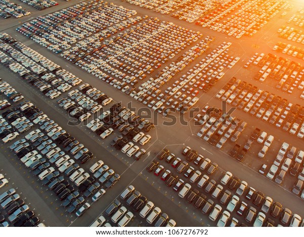 Aerial view a lot of car for import and export\
shipping by ship.