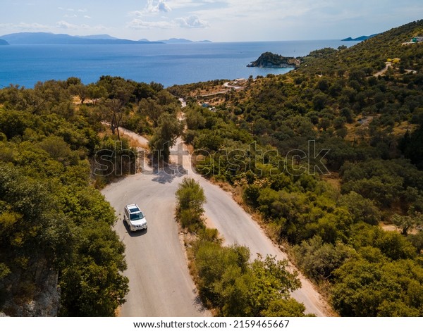 aerial view of car moving by road at Lefkada island\
Greece near ionian sea
