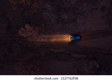 Aerial view of a car on dirt road in the forest Sofia, Bulgaria