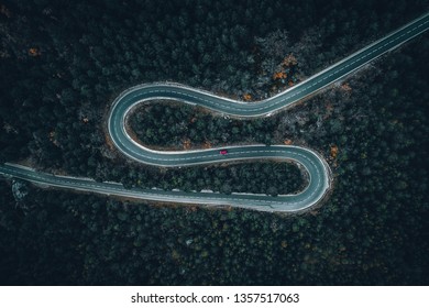 Aerial View Of A Car On A Winding Road In Rural Spain