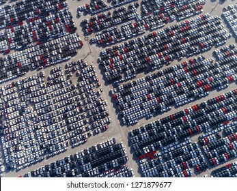 Aerial view car park at sea port or manufacture waiting for logistics ,shipping or export to worldwide. 