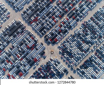 Aerial view car park at sea port or manufacture waiting for logistics ,shipping or export to worldwide. 