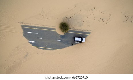 Aerial View Of A Car Stuck In Desert Sands