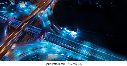 Aerial View Of Car Traffic Transportation Above Circle Roundabout Road Of Drone Aerial View Fly , High Angle. Public Transport Or Commuter City Life Concept Of Economic And Energy, Infrastructure	