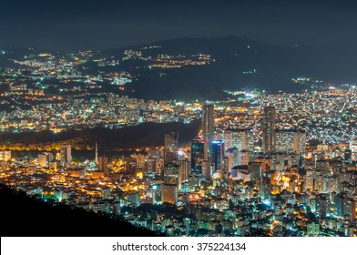 Aerial view of Caracas, at night, from a lookout in Avila mountain, showing the central part of the city, with the twin towers of Central Park.