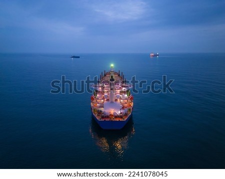Aerial view cargo bulk carrier ship on the sea at night
