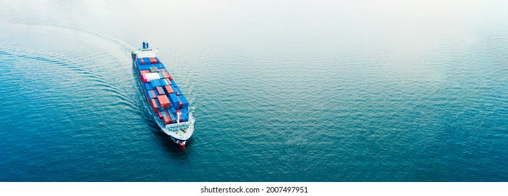 Aerial view Cargo container ship. Business logistic transportation  in the ocean ship carrying container,Cargo ship, Cargo container in factory harbor for import-export, Space for copy