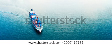 Aerial view Cargo container ship. Business logistic transportation in the ocean ship carrying container,Cargo ship, Cargo container in factory harbor for import-export with copy space for text. 