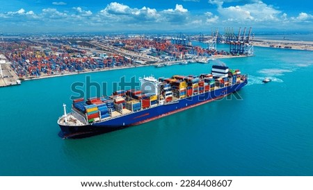 Aerial view of cargo ship carrying container running for export import near cargo yard port concept freight shipping.