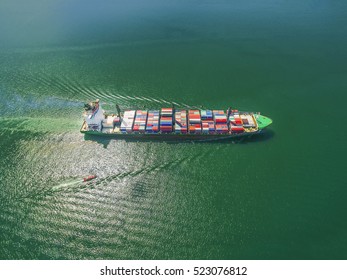 Aerial view of cargo ship, cargo container in warehouse harbor at thailand .