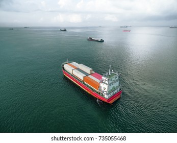 Aerial view of cargo ship, cargo container in warehouse harbor at thailand .