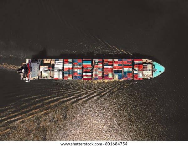 Aerial view of cargo ship, cargo container in warehouse\
harbor at thailand .