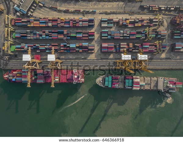 Aerial view of cargo ship, cargo container in warehouse\
harbor at thailand .