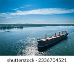 Aerial view of a cargo ship near the Port of Montreal on the St. Lawrence River