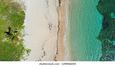 Aerial View Of The Caribbean Sea With Beach Chairs At Reggae Beach Near Christopher Harbor, Saint Kitts