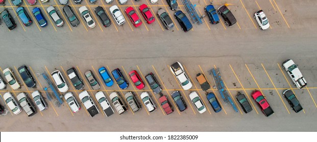 Aerial View Of Cars At Large Outdoor Parking Lots; USA. Outlet Mall Parking Congestion And Crowded Parking Lot; Other Cars Try Getting In And Out; Finding Parking Space. Panorama