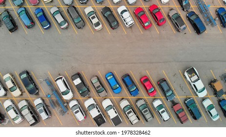 Aerial View Of Cars At Large Outdoor Parking Lots, USA. Outlet Mall Parking Congestion And Crowded Parking Lot, Other Cars Try Getting In And Out, Finding Parking Space.