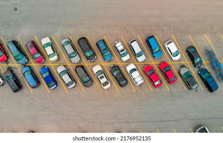 Aerial View Of Cars At Large Outdoor Parking Lots, USA. Outlet Mall Parking Congestion And Crowded Parking Lot, Other Cars Try Getting In And Out, Finding Parking Space.