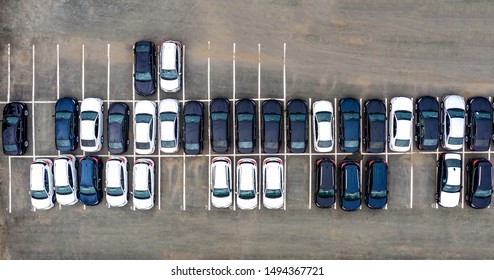 Aerial View Cars For Sale Stock Lot Row, Car Dealer Inventory, Parking Lot. Black And White New Cars Are In Row