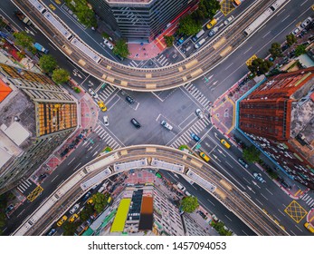 Aerial view of cars and trains with intersection or junction with traffic, Taipei Downtown, Taiwan. Financial district and business area. Smart urban city technology. - Shutterstock ID 1457094053