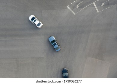 Aerial View Of Cars Turning At City Street Intersection