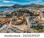 Aerial view of Cartagena port city in Spain surrounded by bastions and fortifications, medieval castle hill, roman amphitheater, bull ring, 