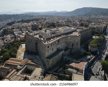 Aerial view of Castel Sant'elmo in Naples, Italy. The Castle is located in the Vomero district. Drone view of Spaccanapoli, a line that divides the city in two parts. Vesuvio in the background. 