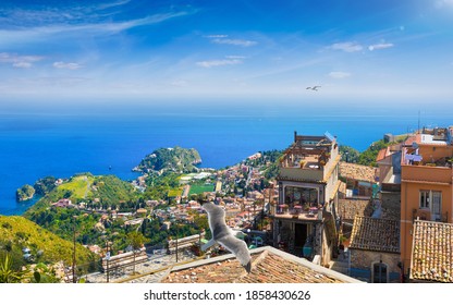 Aerial View Of Castelmola And Taormina Located In Metropolitan City Of Messina, On East Coast Of Sicily, Italy