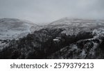 An aerial view of castle campbell Dollar, Clackmannanshire, Scotland on a foggy day