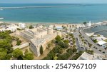 Aerial view of the castle of Manfredonia, in Puglia, Italy. It is a military structure built by the Aragonese and expanded in the eras of Swabian and Angevin domination. In background is Adriatic sea.