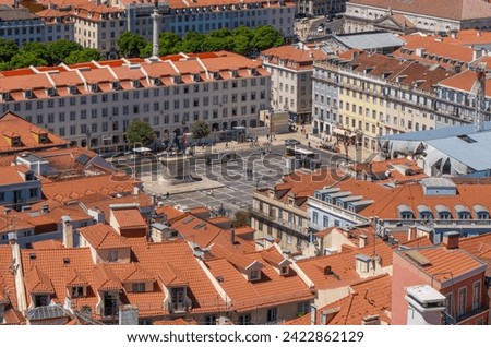 Aerial view from the Castle of Saint George with views of the Fig Tree Square and the equestrian statue of King Joao I, with roofs of the buildings around Lisbon.