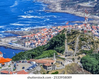 Aerial view of Castro de Santa Trega, an ancient Celtic hillfort in Galicia, Spain, with green landscape and coastal scenery. Shot with a drone, capturing its circular stone structures and surrounding - Powered by Shutterstock