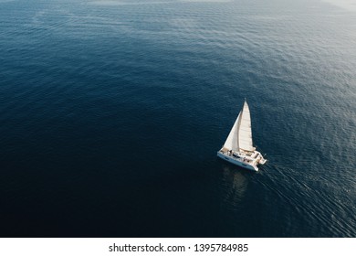 Aerial view of a catamaran on the high seas. Sailing in Greece, Aegean Sea