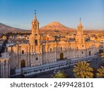 Aerial view of the cathedral of Arequipa Peru at sunset with the background of the Misti volcano