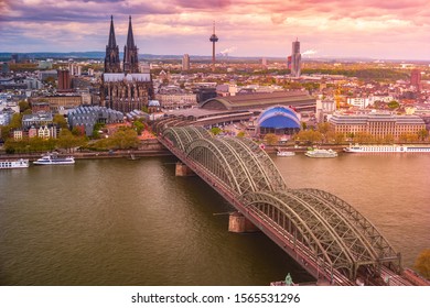 Aerial view of the cathedral in Cologne and Hohenzollern bridge over Rhein, Germany. Pictoresque view on the famous landmarks of Cologne in Germany.