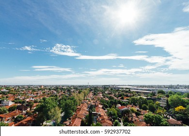 Aerial View Of A Chalet Neighborhood With Sun