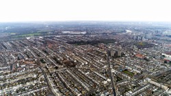Aerial View Of Chelsea, Fulham, West Kensington And Parsons Green In London Cityscape Skyline Drone Shot. Fulham Football Club Stadium Craven Cottage In Distance