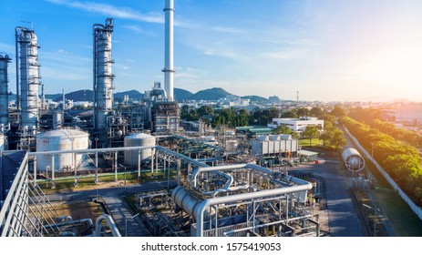 Aerial View Of Chemical Oil Refinery Plant, Power Plant On Blue Sky Background.