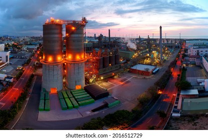 Aerial View Of A Chemical Plant At Sunset With Pipelines, Chimneys And Storage Tanks Throughout The Factory In A Petrochemical Industrial Estate, In Guanyin Industrial Park, Taoyuan City, Taiwan, Asia