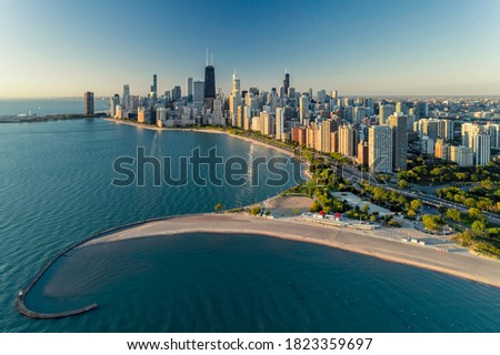 Aerial view of Chicago downtown skyline with park and the beach. Morning light with clear blue sky