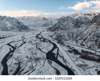 Aerial view of China Pamir Plateau snow mountain in winter. Drone Shot Photo. - Powered by Shutterstock