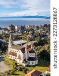 Aerial view of the Church of Puerto Varas with Lake and Osorno Volcano in the background captured with a drone.