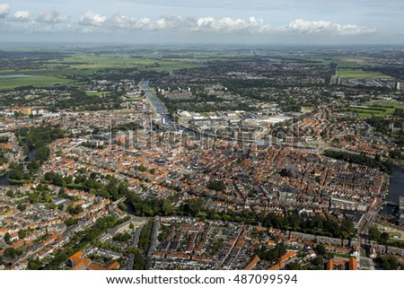 Aerial view of the city of Alkmaar. On the clear horizon a blue sky with cumulus clouds.
Alkmaar is an old town in NOORD-HOLLAND, The Netherlands and known for it's KAASMARKT or cheese market. Stock photo © 