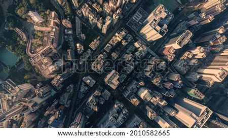 Aerial view city central park, trains, buildings and skyscrapers in Hong Kong at the sunset. Asia business concept photo