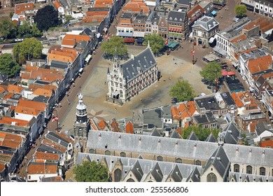 Aerial View Of The City Of Gouda With The Old Town-hall, Weigh-house And St. John Church In The Province Of Zuid-Holland, The Netherlands.