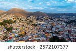 Aerial view of the city of Guanajuato at sunset. From the air you will be able to see its intricate streets and its most characteristic historical sites.