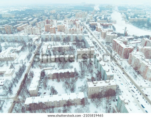Aerial view of the\
city streets in the snow